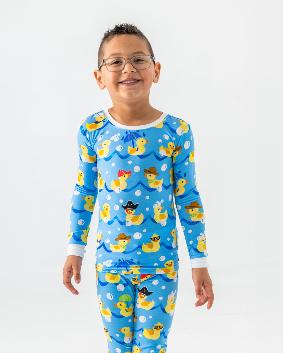 Close up of boy wearing the Splish Splash Two-Piece Pajama Set