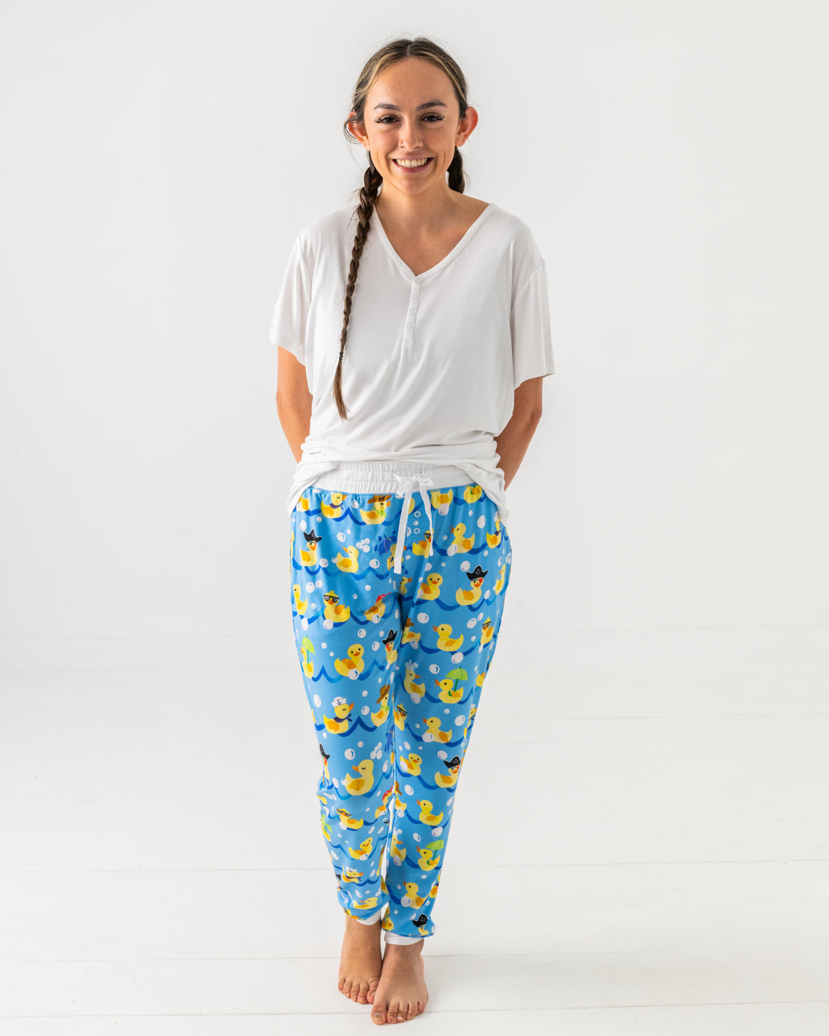 Standing woman wearing the Splish Splash Women's Pajama Pants with a white pajama top