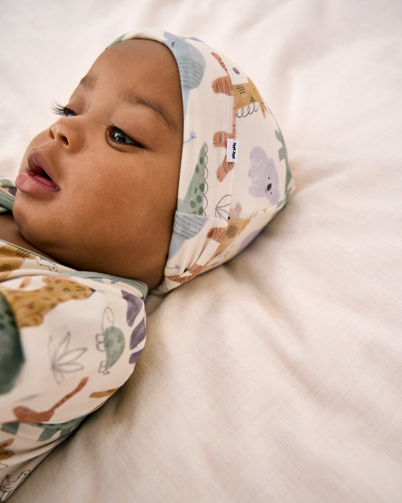 Close up of baby wearing the Sweet Safari Infant Beanie