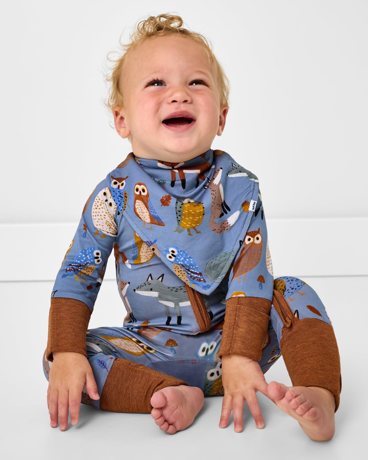 Sitting child wearing the Twilight Pals Bandana Bib