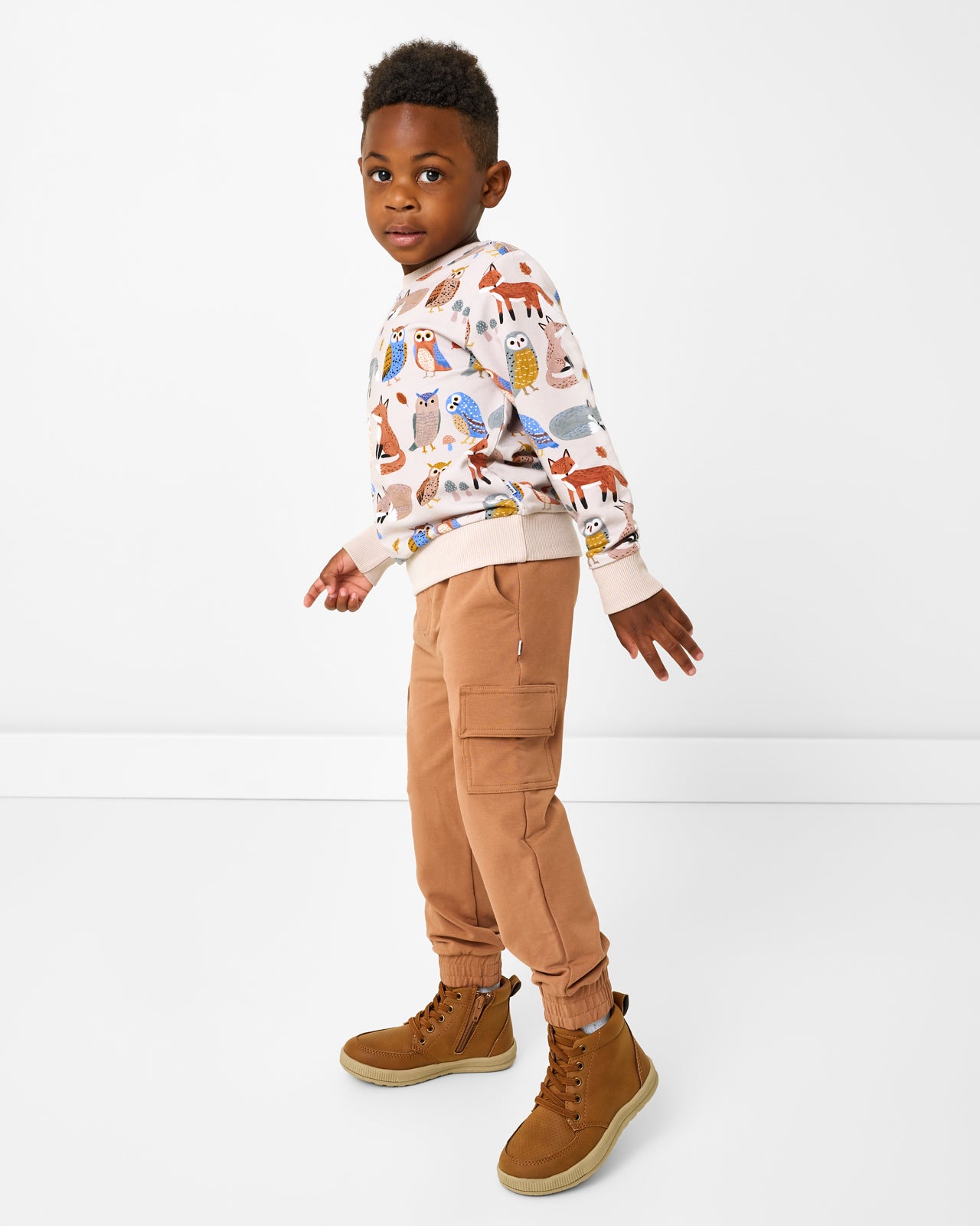 Boy wearing the Twilight Pals Crewneck Sweatshirt with cargo joggers