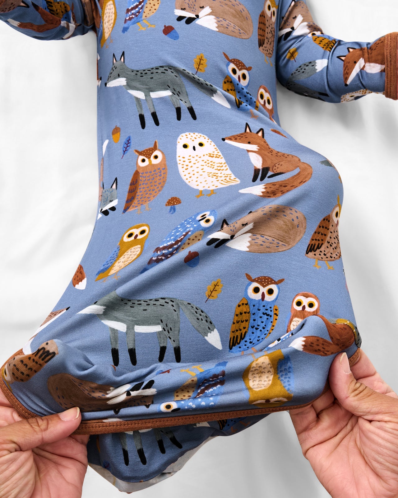 Adult demonstrating the envelope sweep on the Twilight Pals Infant Gown