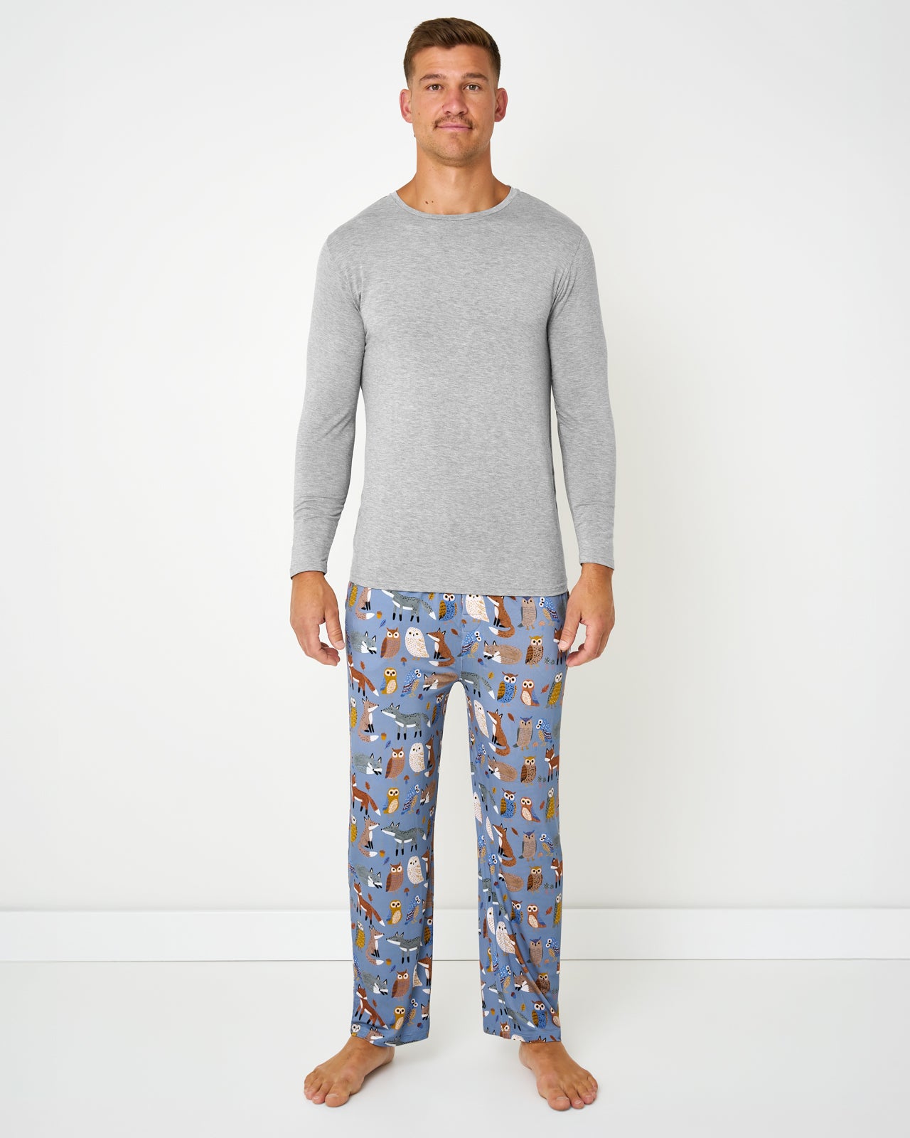 Man wearing the Twilight Pals Men's Pajama Pants with a gray pajama top