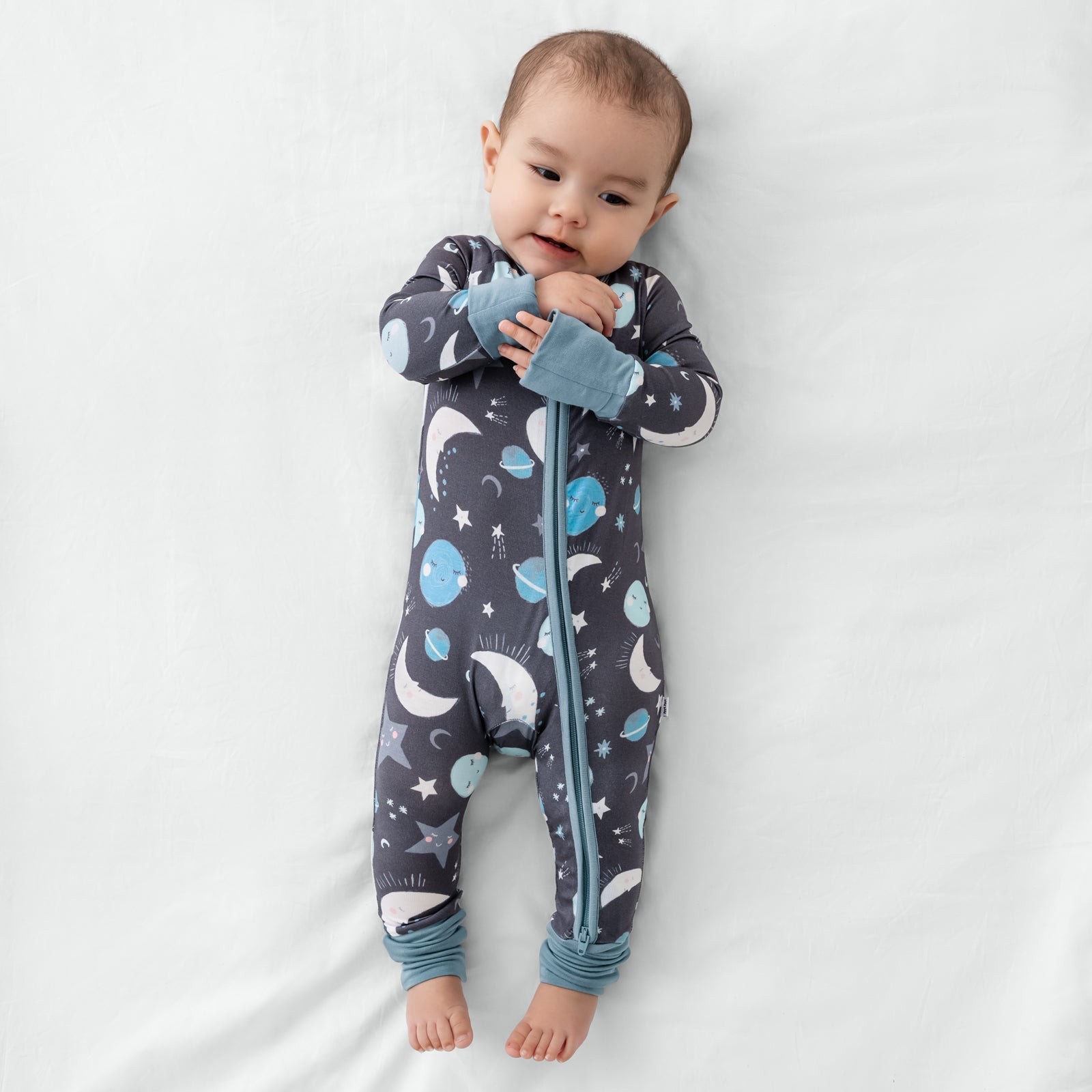 Aerial view of child wearing the Blue To the Moon & Back Zippy