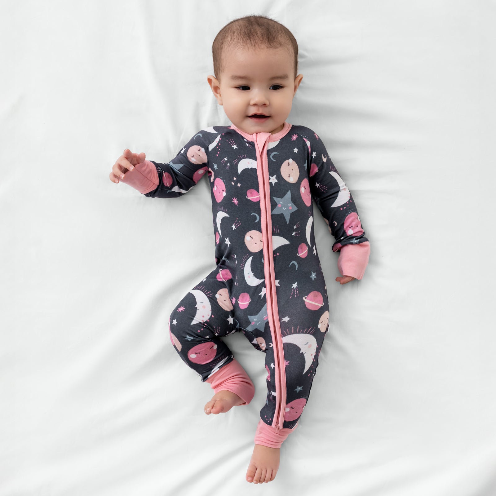 Aerial view of child wearing the Pink To the Moon & Back Zippy