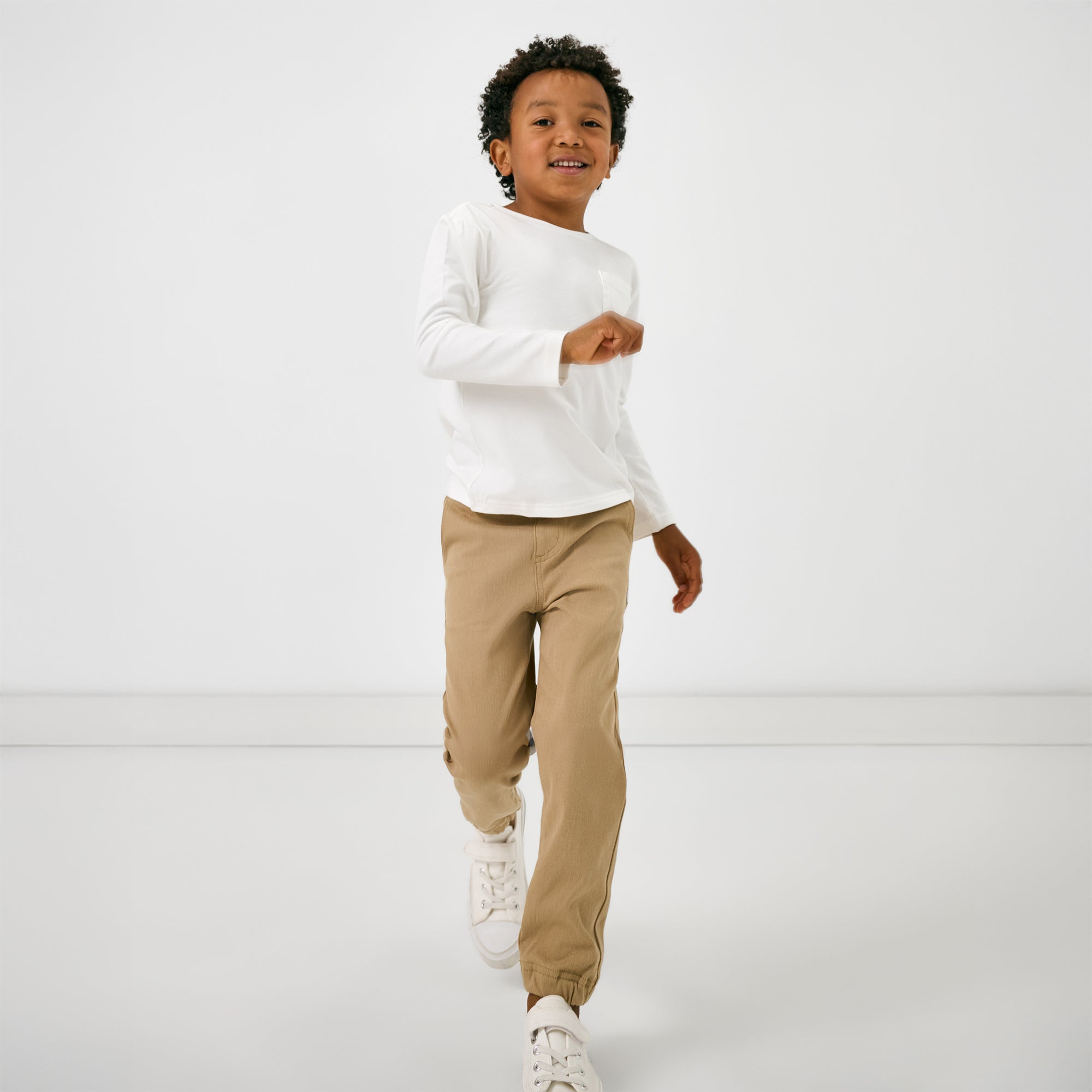 Child in motion wearing the Toasted Hazelnut Denim Jogger