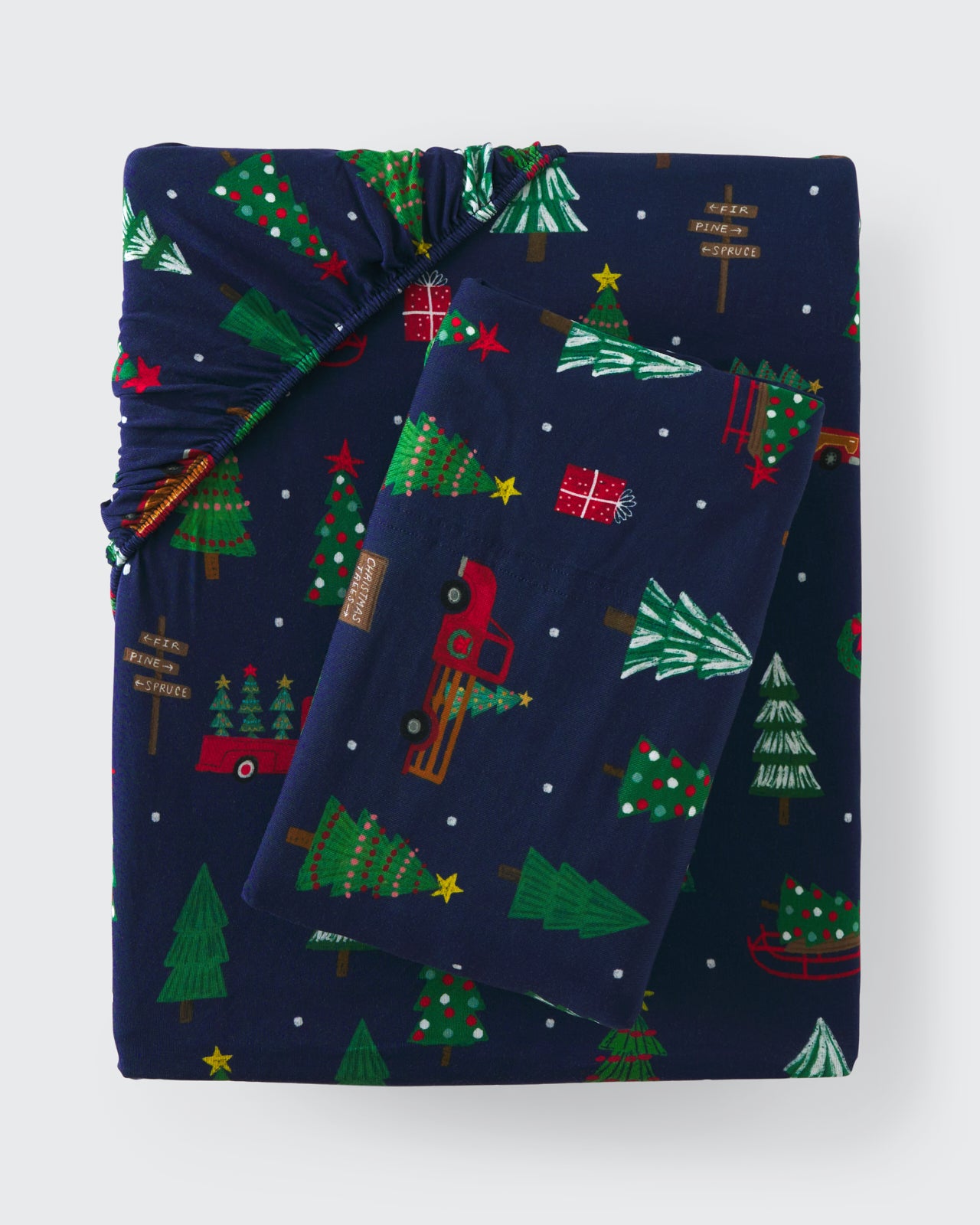 Flat lay of the Navy Tree Traffic Twin Sheet Set