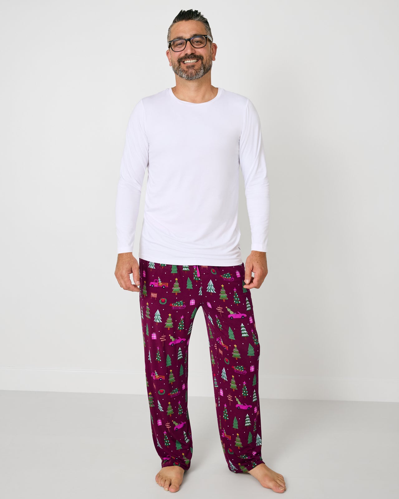 Man wearing the Cranberry Tree Traffic Men's Pajama Pants with a white pajama top
