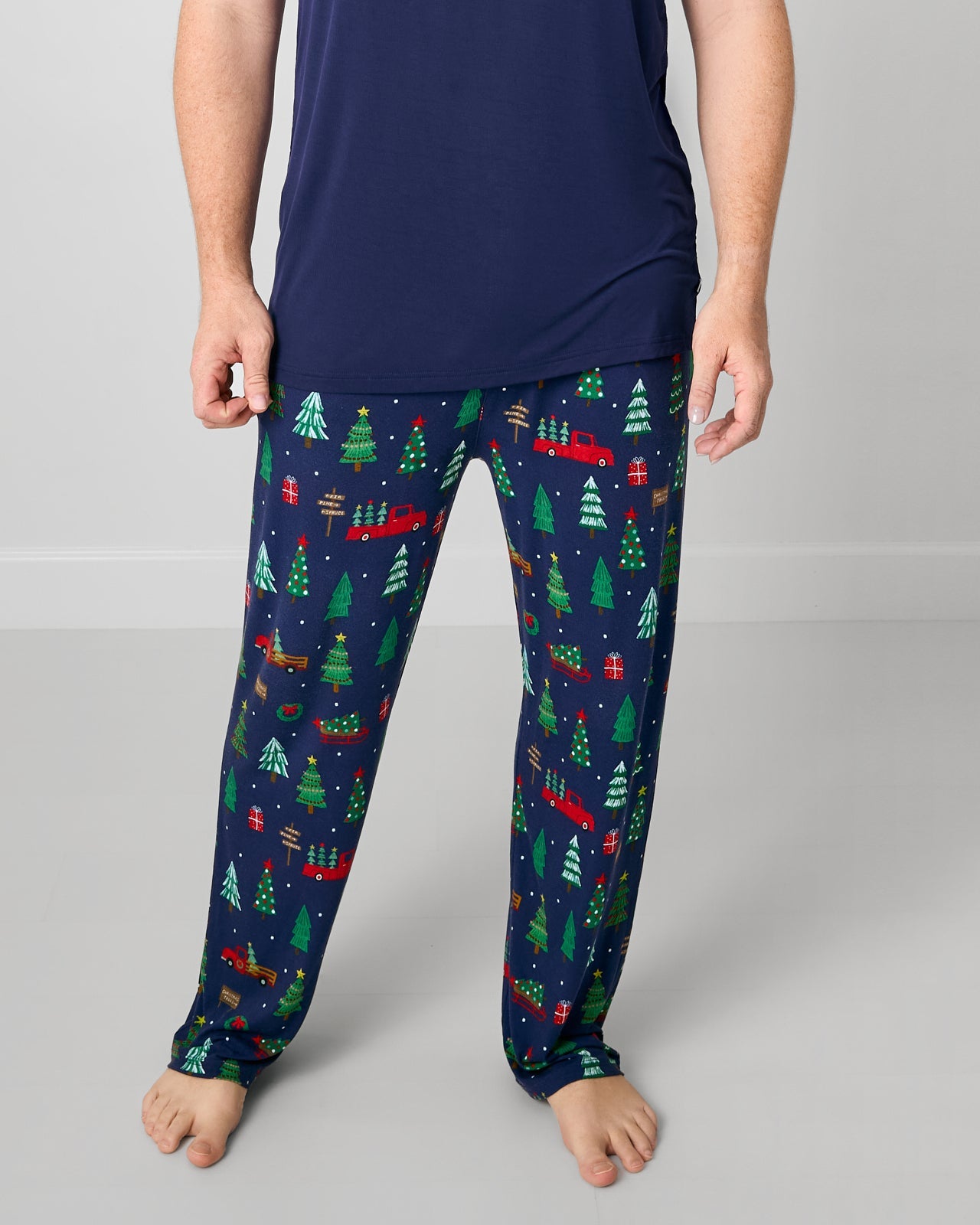 Man wearing the Navy Tree Traffic Men's Pajama Pants with a navy pajama top