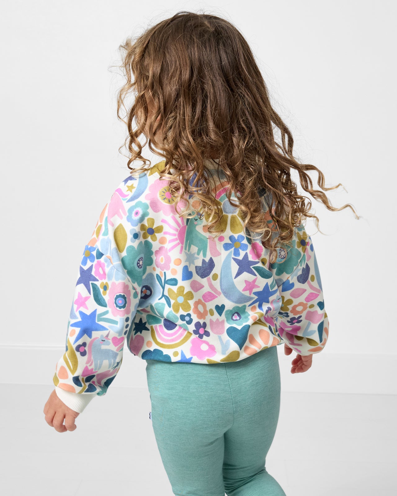Back view of child wearing the Unicorn Blossoms Drop Shoulder Crewneck