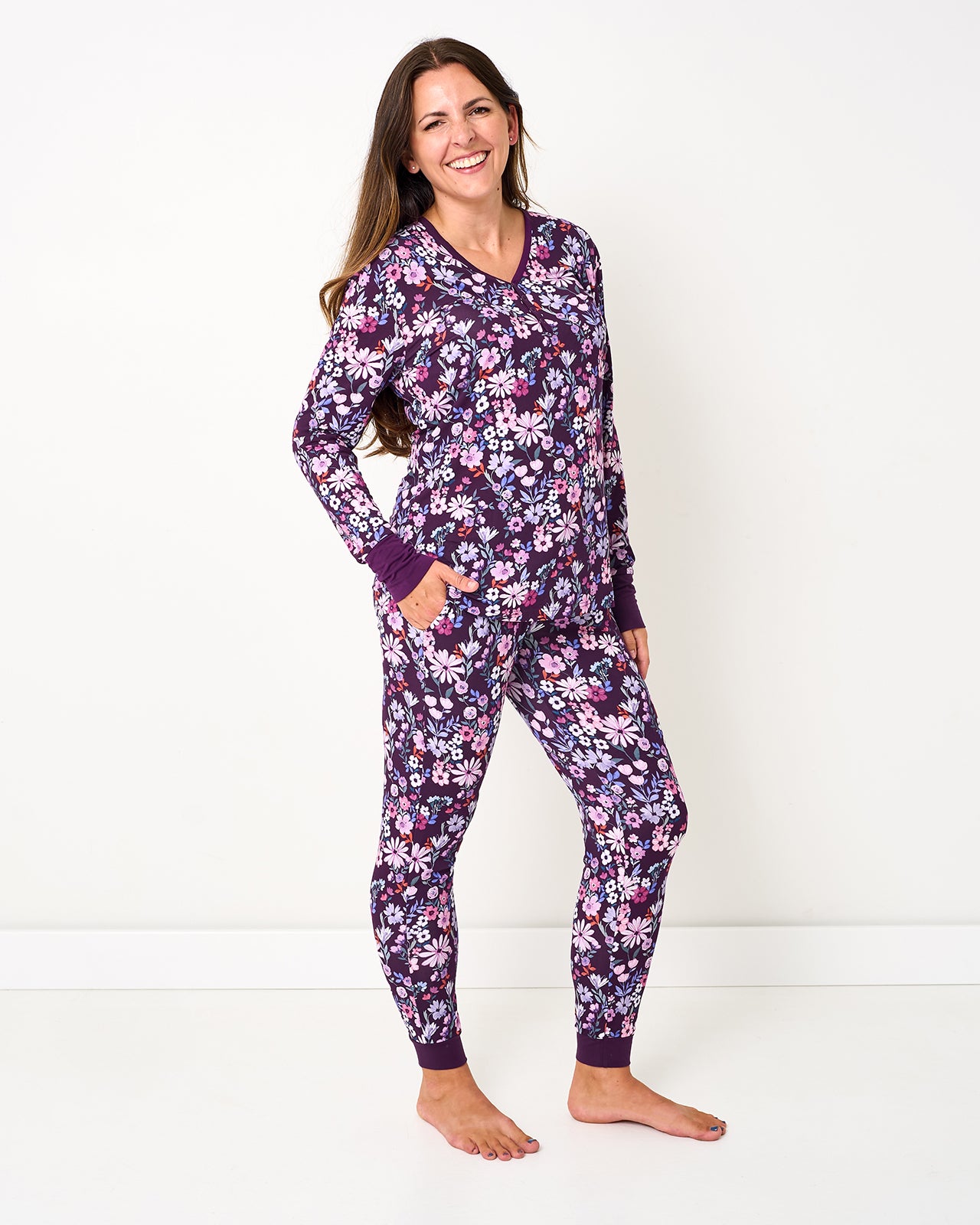 Woman wearing the Violet Meadow Women's Long Sleeve Pajama Top and matching floral pajama pants