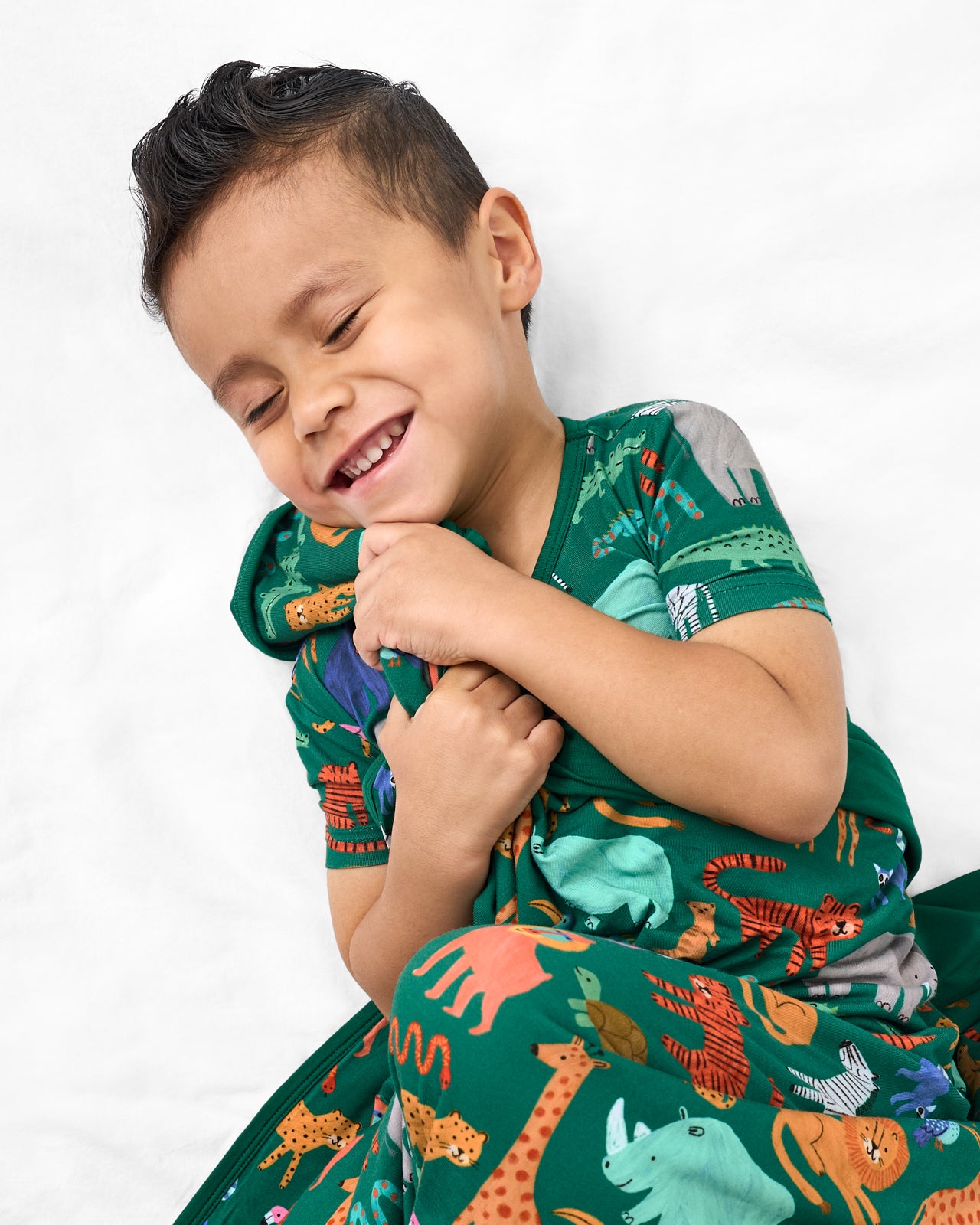 Aerial view of boy cuddled with the Wild Zoo Large Cloud Blanket®