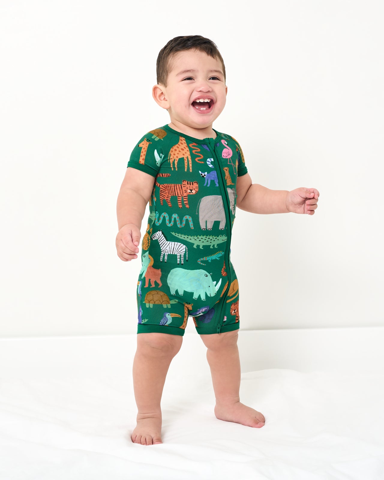 Standing toddler wearing the Wild Zoo Shorty Zipper Pajamas