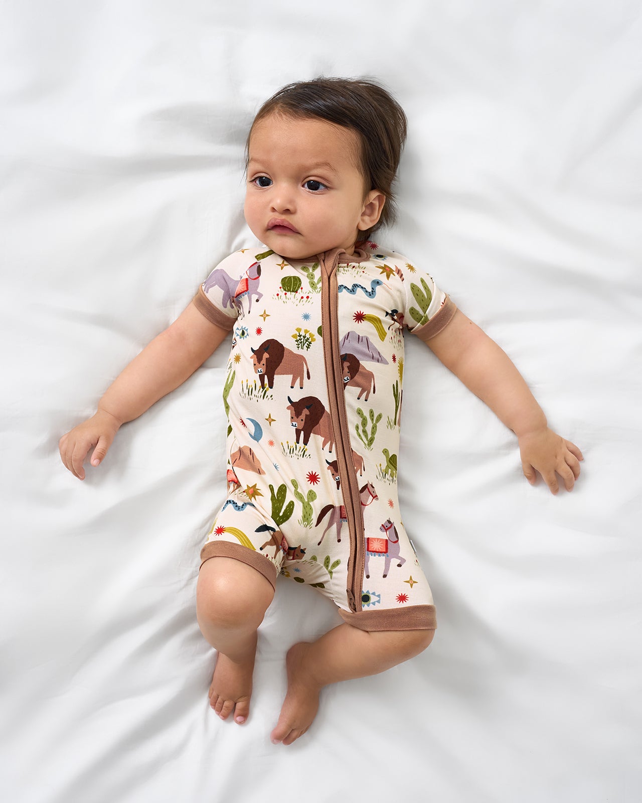 Aerial view of baby wearing the Wild Frontier Shorty Zippy