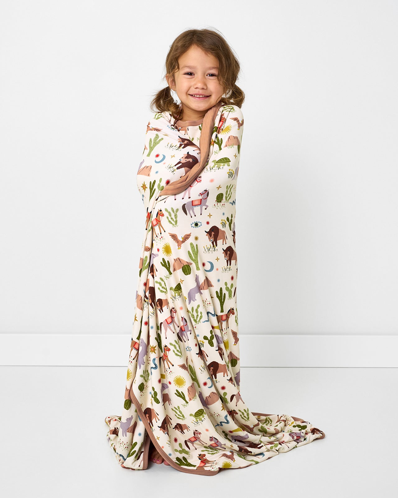 Child wrapped in the Wild Frontier Large Cloud Blanket®