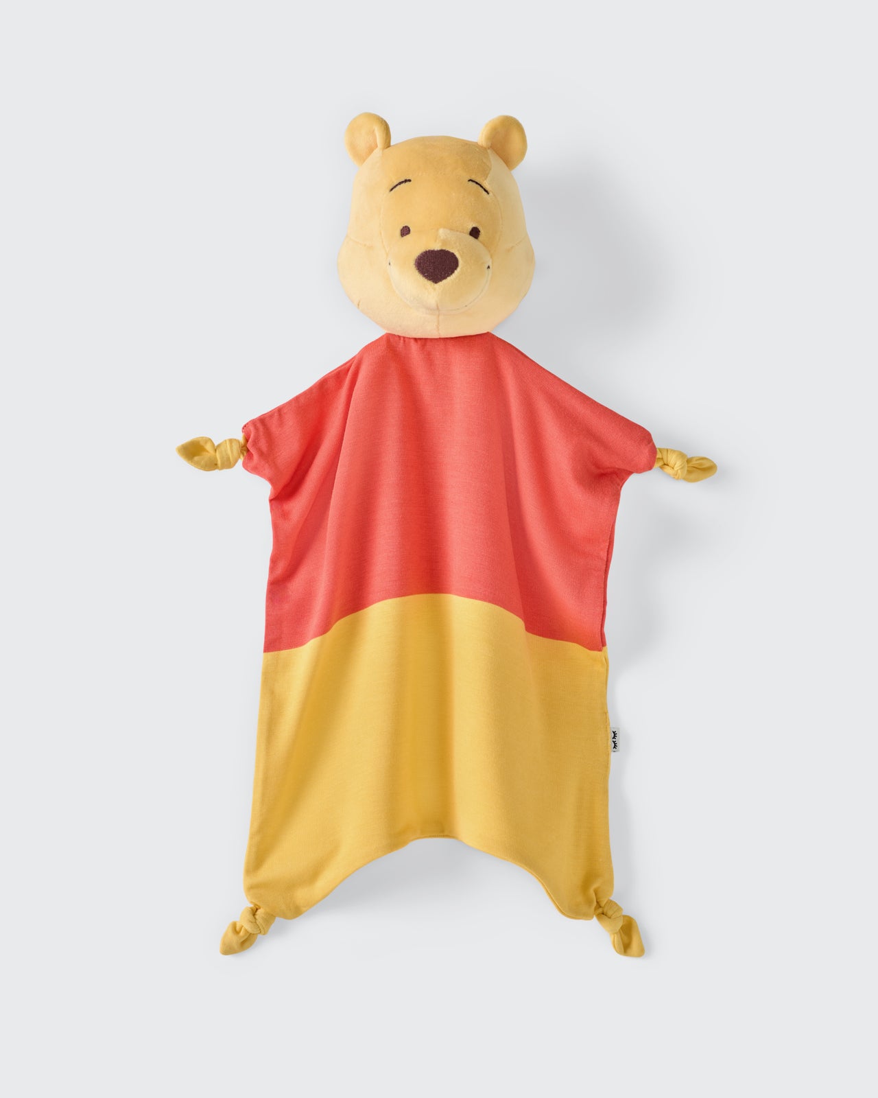 Flat lay of the Disney Winnie The Pooh Lovey