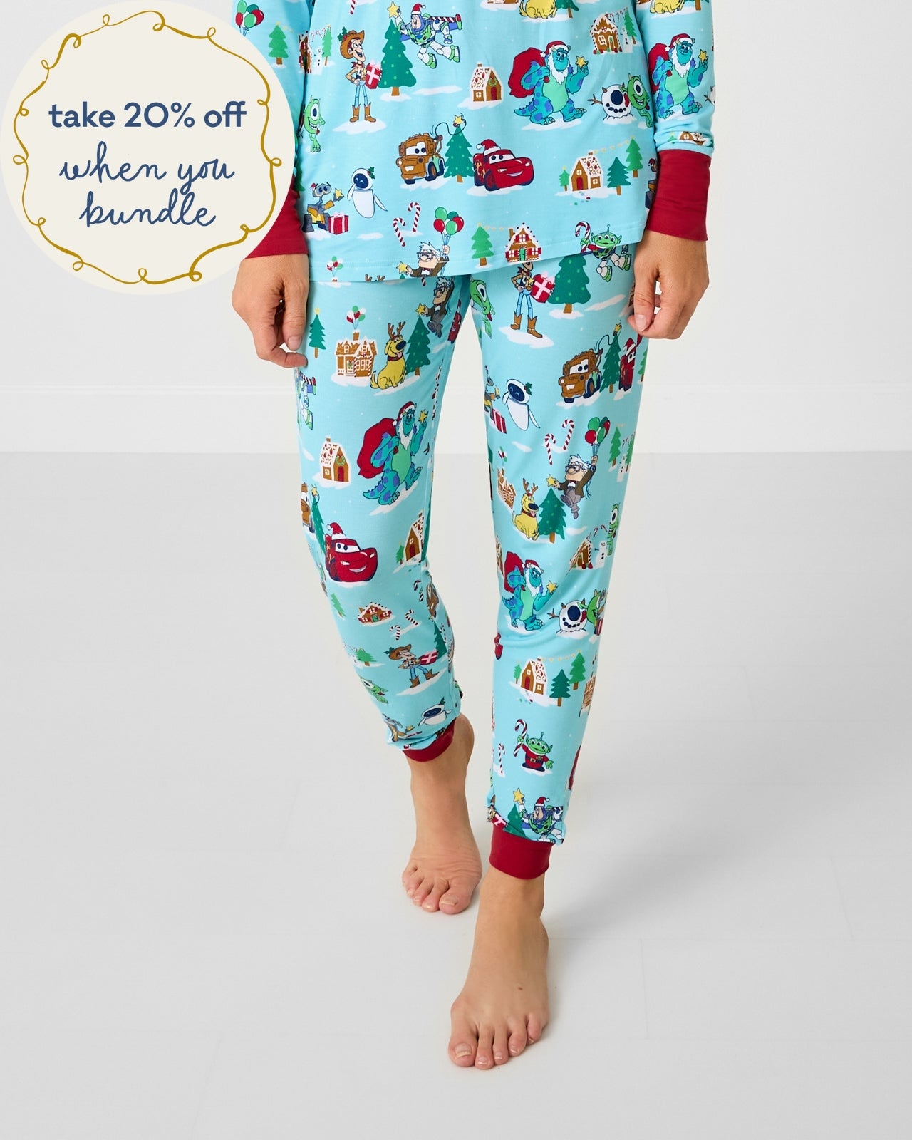 Woman wearing the Disney & Pixar Christmas Village Women's Pajama Pants
