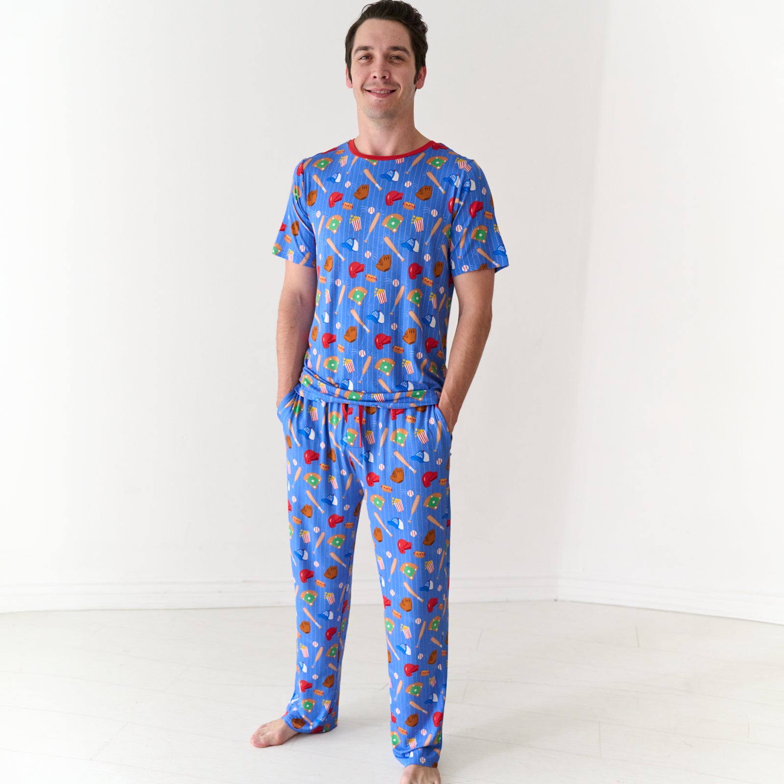 Man wearing a Blue All Stars men's short sleeve bamboo pajama top and bamboo pajama pants