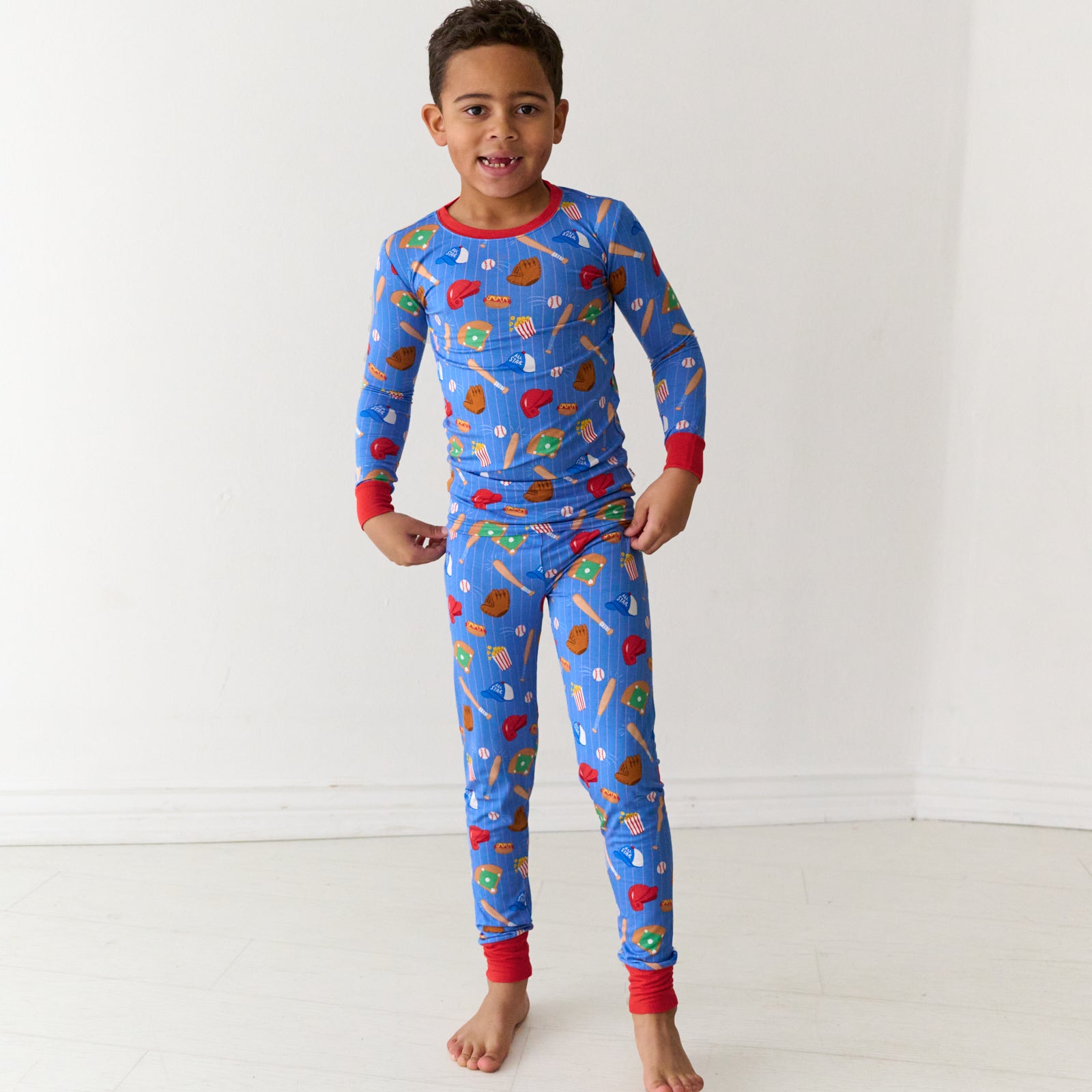 Child wearing a Blue All Stars two-piece long sleeve and pants bamboo kids pajama set
