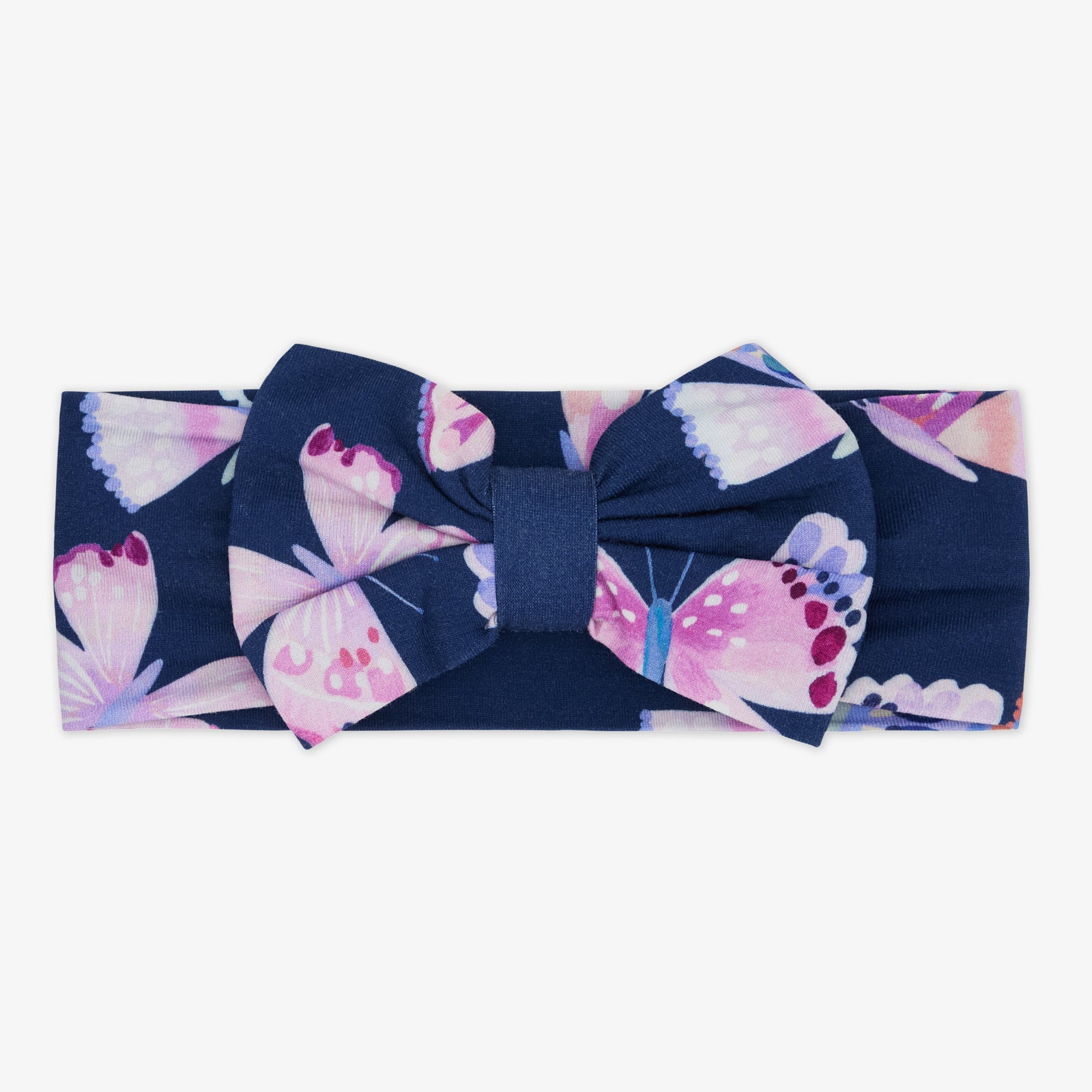 Flat lay of the Royal Butterflies Luxe Bow Headband