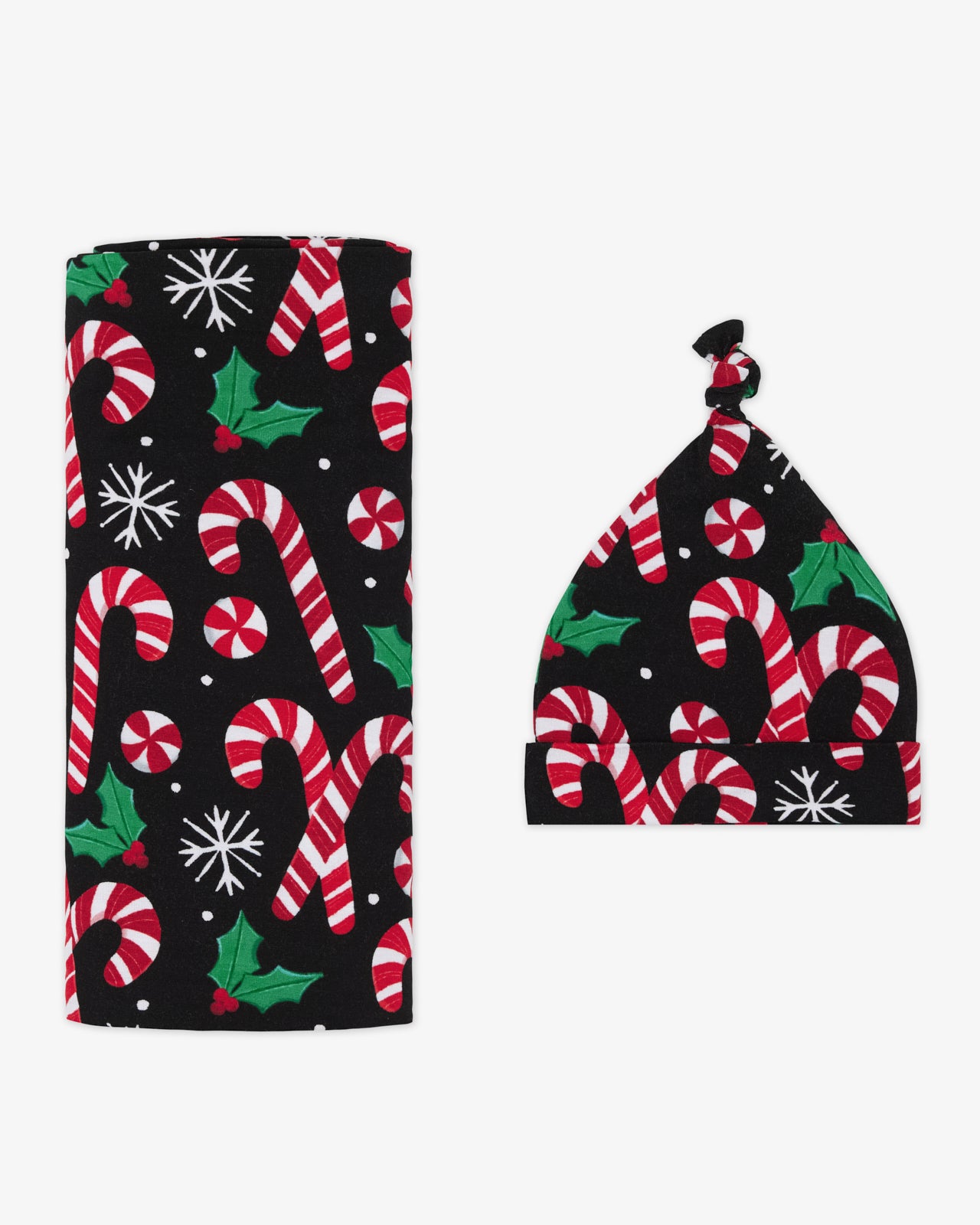 Flat lay of the Merry Mints Swaddle & Hat Set