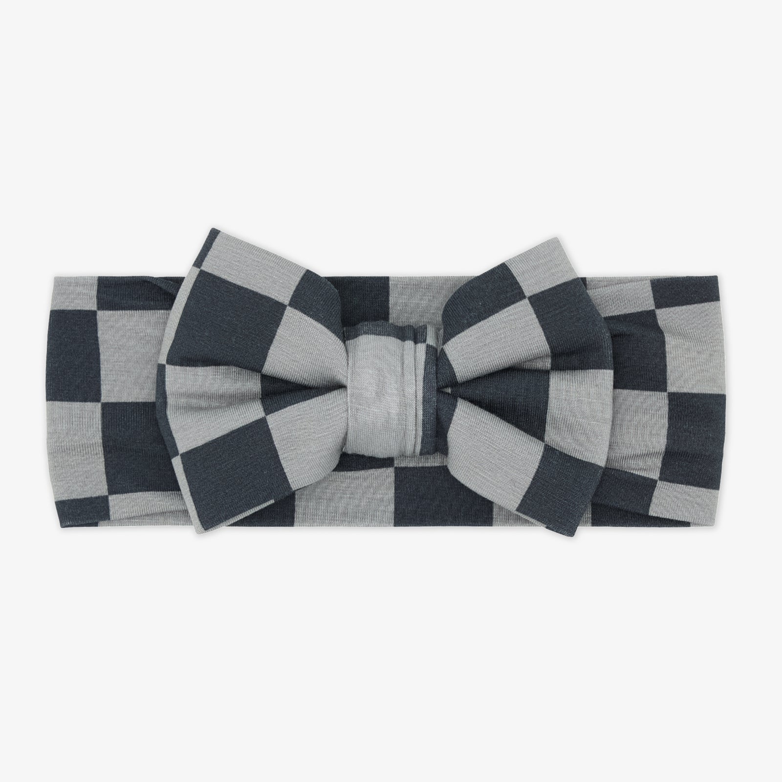 Flay lay of the Checkerboard Luxe Bow Headband in the Disney Cars collection