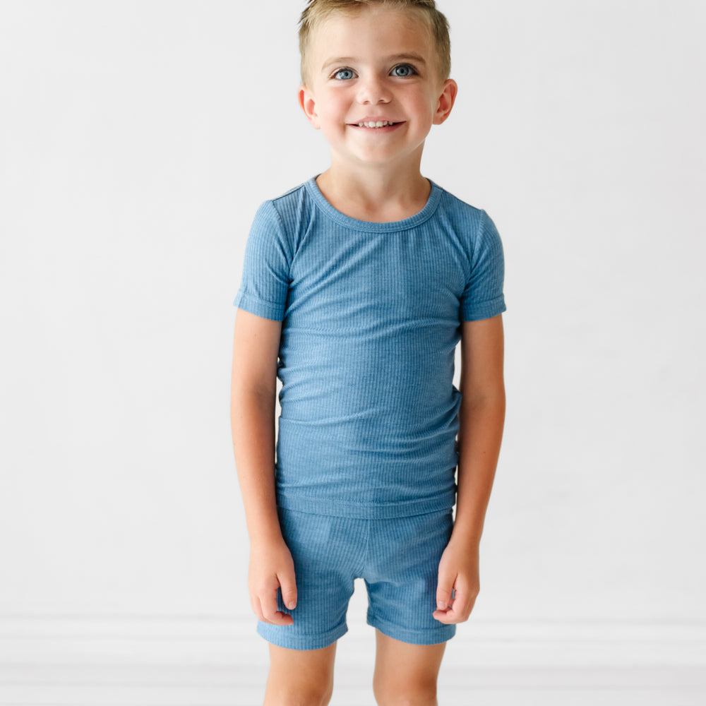 Child wearing Heather Blue Ribbed two piece short sleeve and shorts pajama set