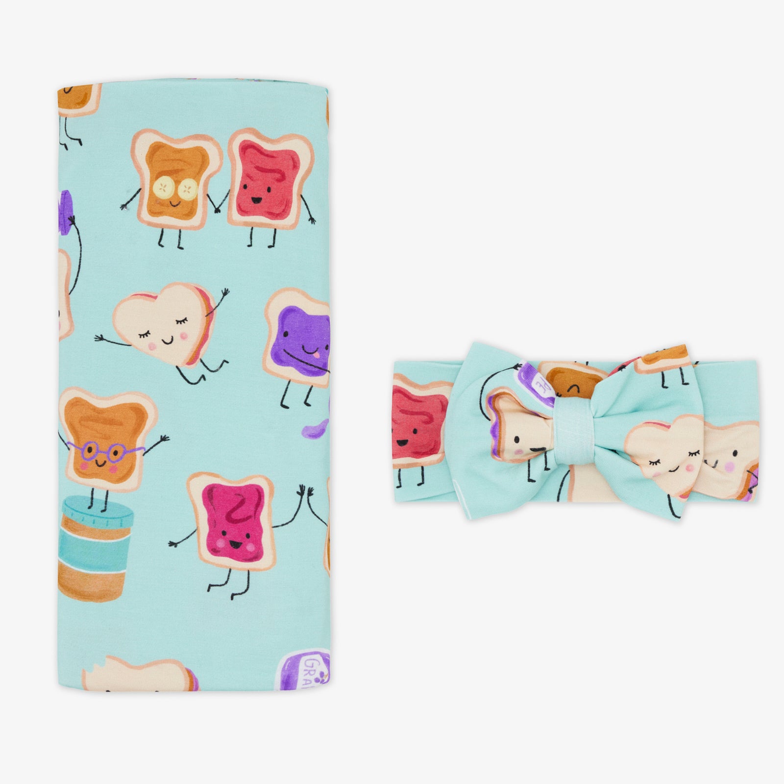 Flat lay of the Lunch Buddies Swaddle & Luxe Bow Headband Set