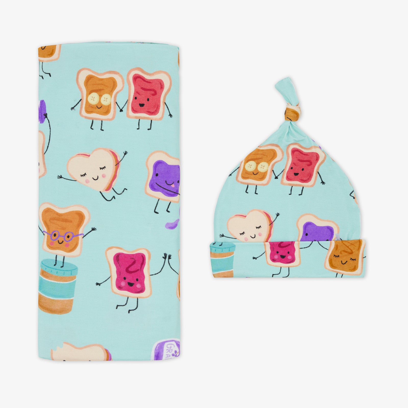 Flat lay of the Lunch Buddies Swaddle & Hat Set