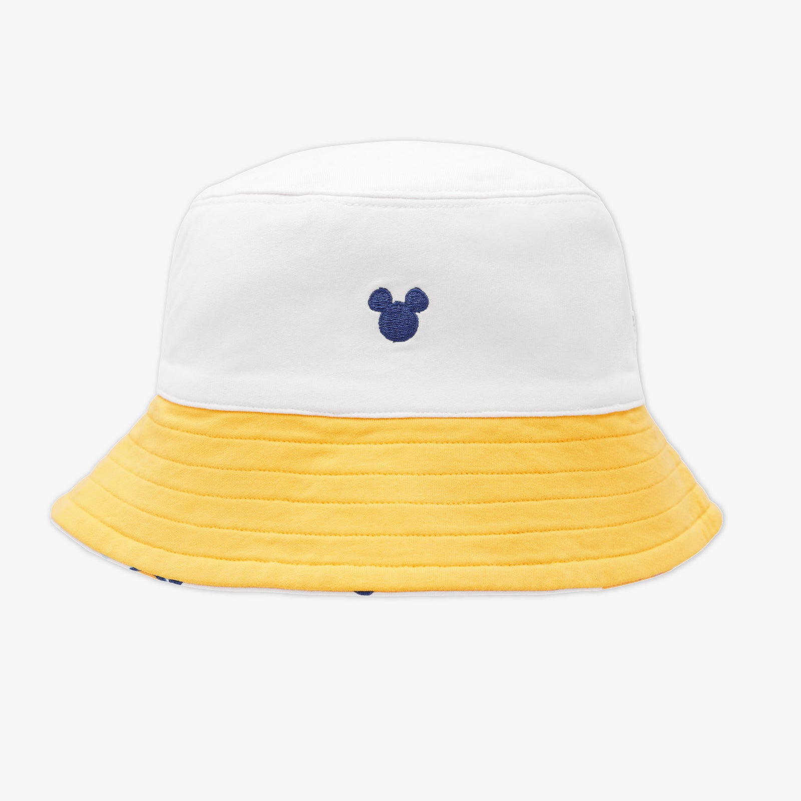 Flat lay of the solid white and yellow side of the Disney Mickey's Clubhouse Reversible Bucket Hat