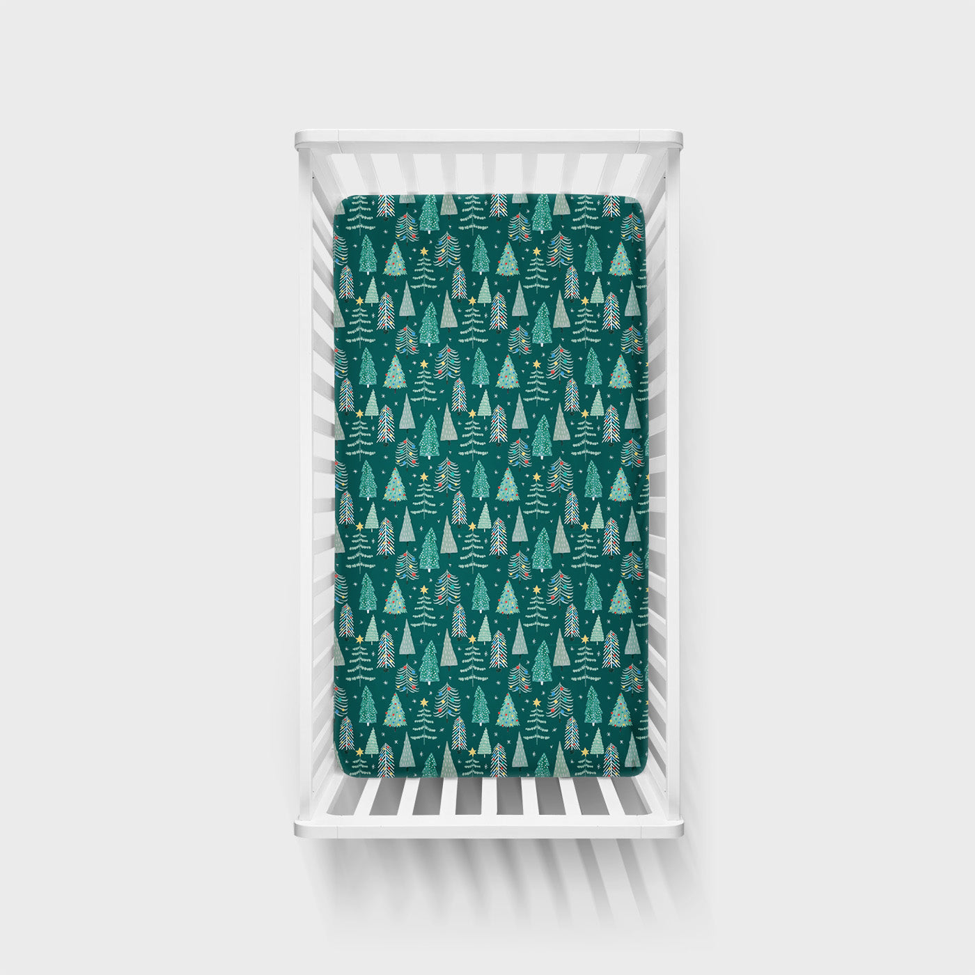 Overhead view of the Twinkling Trees Fitted Crib Sheet