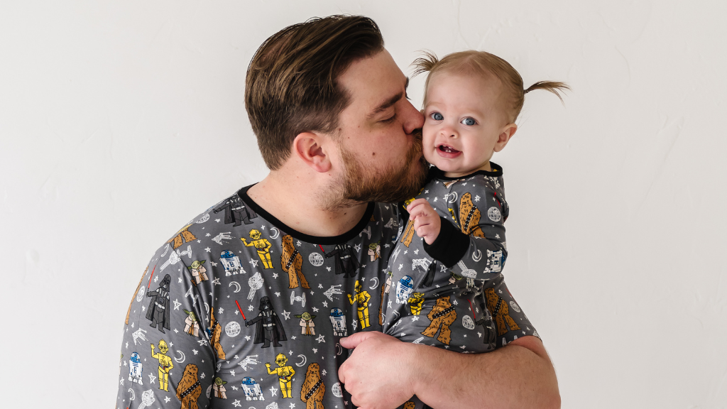 Father and daughter in family matching pajamas of Star Wars May The Force Be With You