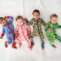 Four Children wearing various LS sports collection pj sets