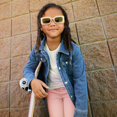 child wearing a midwash blue denim trucker jacket