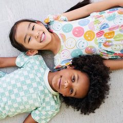 children wearing Watercolor Checks and Positive Vibes prints