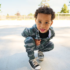 child wearing vintage camo zip hoodie and matching joggers