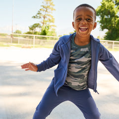 child wearing Vintage Navy Zip Hoodie and matching Joggers