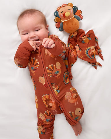 Aerial view of baby wearing the Grateful Gobbles zippy