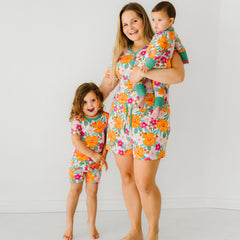 Mother and children wearing matching Beachy Blooms pajama sets