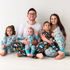 Family in coordinating and matching pajamas in Keys & Chords and Play Along from The Music Collection from Little Sleepies.