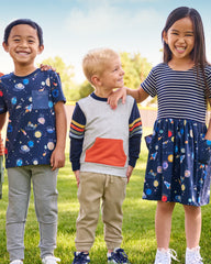 five children walking to school wearing Play by Little Sleepies styles