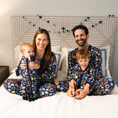 family of four wearing matching Playful Dreidels pj sets