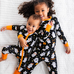 two children cuddling wearing Friendly Ghosts printed pjs