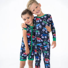 Two children wearing Monster Truck Madness pjs