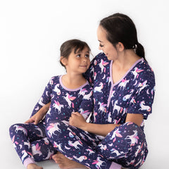 mother and daughter wearing matching magical skies pjs