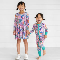 image of two children wearing Sweet Pea Floral printed zippy and twirl dress