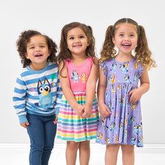 Three children wearing Bluey Play by Little Sleepies outfits
