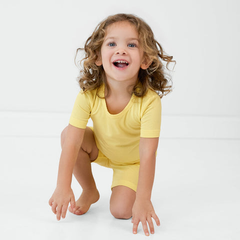 Crawling child wearing the Lemon Twist two-piece pajama set