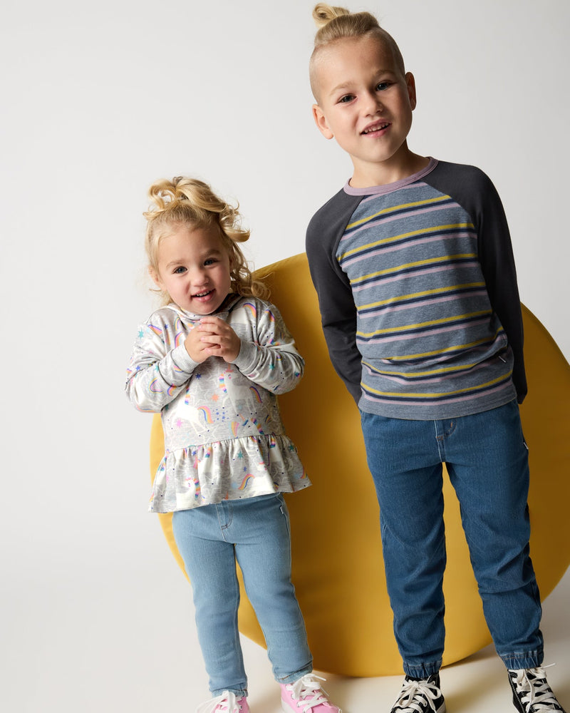 two kids wearing little sleepies play styles