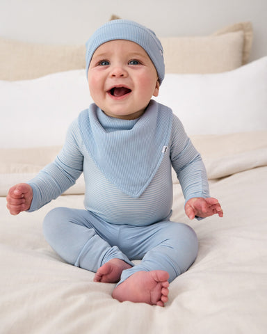 Baby boy wearing Light Fog newborn clothing